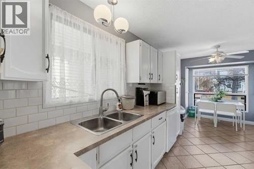 96 Abberfield Crescent Ne, Calgary, AB - Indoor Photo Showing Kitchen With Double Sink
