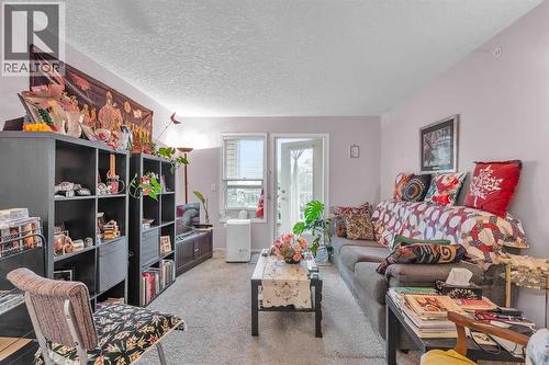 3340, 6818 Pinecliff Grove Ne, Calgary, AB - Indoor Photo Showing Living Room
