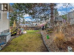 SIDE YARD - Beautiful lawn and garden areas. - 