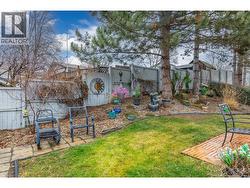 BACK YARD - Beautiful  flower gardens and lawn. - 