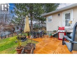 BACK PATIO - Generous sized fenced backyard with deck. - 