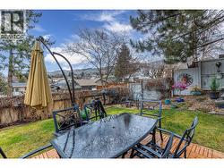 BACK PATIO - Wooden deck and bar area. - 