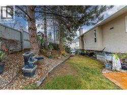 SIDE YARD - Beautiful, level lawn area. - 