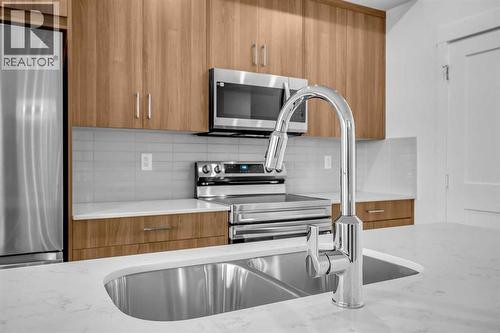 7209, 1802 Mahogany Boulevard, Calgary, AB - Indoor Photo Showing Kitchen With Double Sink With Upgraded Kitchen