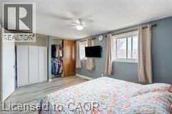 Bedroom with wood finished floors - 