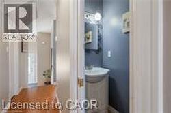 Bathroom with vanity and wood finished floors - 