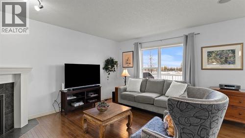 166 Bridlecrest Boulevard Sw, Calgary, AB - Indoor Photo Showing Living Room With Fireplace