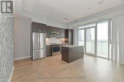 Spacious Kitchen W Centre Island & W/O To Balcony - 