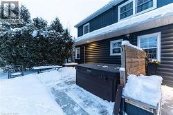 Side of house where hot tub is located - 