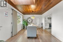 Dining space with wooden ceiling, wood floors - 