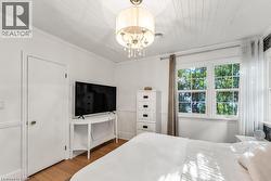 Bedroom featuring wood finished floor - 