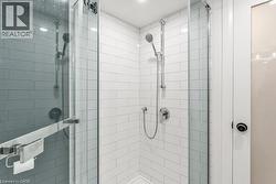 Bathroom featuring a stall shower - 