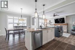 Overall view of primary living space. Note the large patio door to exterior and the custom wood Califormia shutters. - 