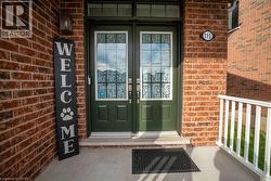 Entrance to property featuring double french doors, transon on covered porch. - 