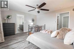 Alternate view of Primary Bedroom showing access to Ensuite bath and walk-in closet. - 