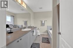 Bathroom with vanity and a garden tub - 