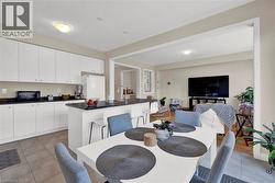 Dining room featuring light tile patterned flooring - 