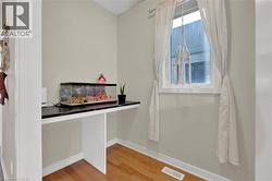 Detailed view of baseboards and wood finished floors - 