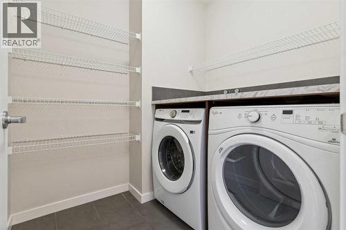 116 Walden Parade Se, Calgary, AB - Indoor Photo Showing Laundry Room