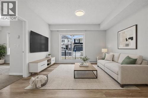 1106, 33 Carringham Gate Nw, Calgary, AB - Indoor Photo Showing Living Room