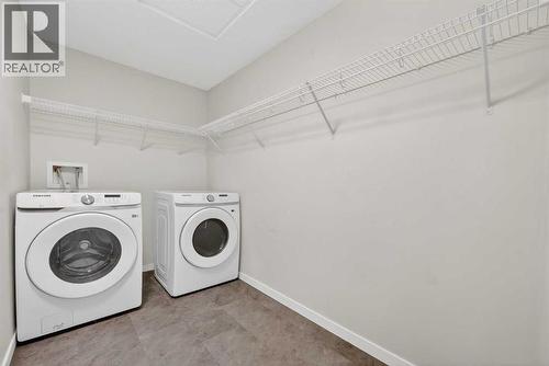 1106, 33 Carringham Gate Nw, Calgary, AB - Indoor Photo Showing Laundry Room