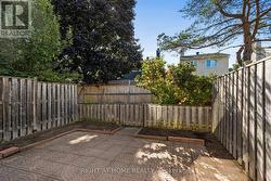 Fall photo - backyard with patio and garden area - 