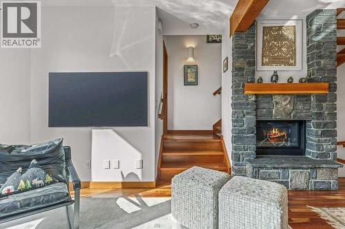 4, 511 6Th Avenue, Canmore, AB - Indoor Photo Showing Living Room With Fireplace