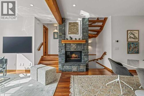 4, 511 6Th Avenue, Canmore, AB - Indoor Photo Showing Living Room With Fireplace