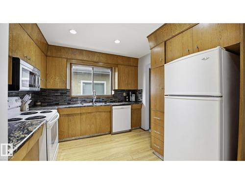 8911 83 Av Nw, Edmonton, AB - Indoor Photo Showing Kitchen With Double Sink
