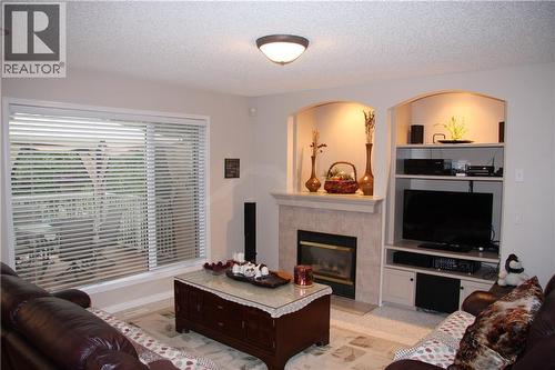 805 Panorama Hills Drive Nw, Calgary, AB - Indoor Photo Showing Living Room With Fireplace