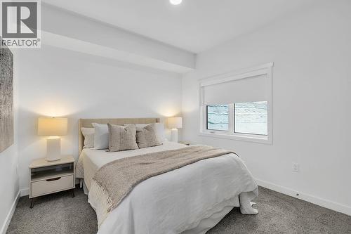 Primary bedroom - photos are of our showhome - 1057 Frost Road Unit# 317, Kelowna, BC - Indoor Photo Showing Bedroom