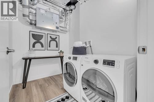 Energy Star washer & dryer - photos are of our showhome - 1057 Frost Road Unit# 317, Kelowna, BC - Indoor Photo Showing Laundry Room