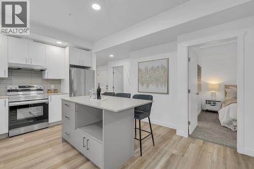photos are of our showhome - 1057 Frost Road Unit# 317, Kelowna, BC - Indoor Photo Showing Kitchen With Upgraded Kitchen