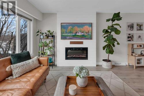 184 Cornwallis Drive Nw, Calgary, AB - Indoor Photo Showing Living Room With Fireplace