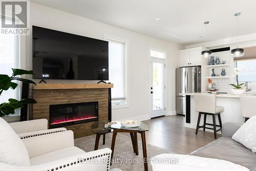 The fireplace is electric and is included. - 1 Princeton Common Street, St. Catharines (Lakeport), ON 