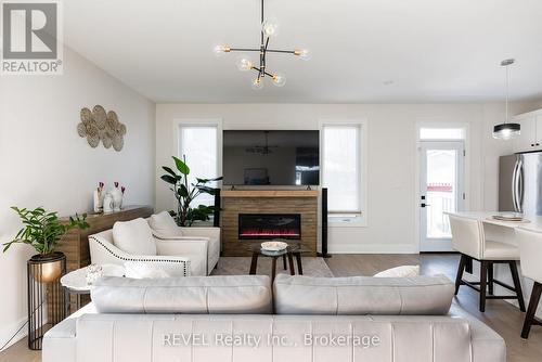 The sideboard mounts above the fireplace for a TV. - 1 Princeton Common Street, St. Catharines (Lakeport), ON 