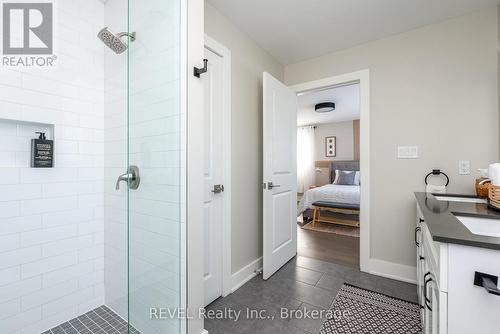 It features a stylish walk-in shower. - 1 Princeton Common Street, St. Catharines (Lakeport), ON 