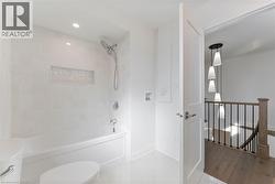 Full bath featuring shower / washtub combination and recessed lighting - 