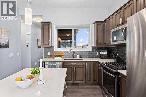 Quartz counters - 103 Masters Heights Se, Calgary, AB - Indoor Photo Showing Other Room
