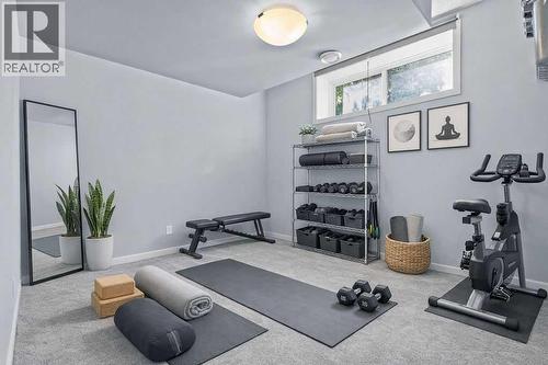 2nd basement bedroom with walk-in closet - 103 Masters Heights Se, Calgary, AB - Indoor Photo Showing Gym Room