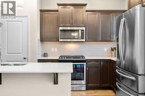 50 Legacy Glen Common Se, Calgary, AB - Indoor Photo Showing Kitchen With Double Sink With Upgraded Kitchen