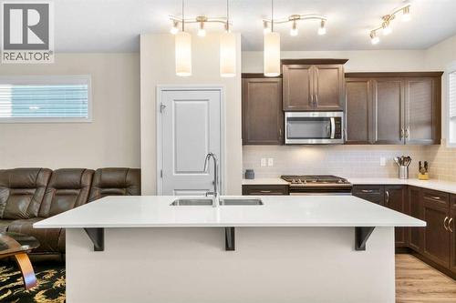50 Legacy Glen Common Se, Calgary, AB - Indoor Photo Showing Kitchen With Double Sink With Upgraded Kitchen