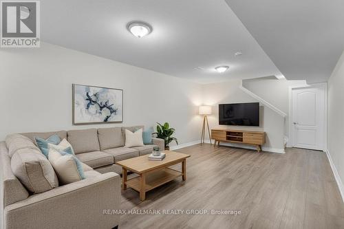 Photo is virtually staged. - 229 Meadowbreeze Drive, Ottawa, ON - Indoor Photo Showing Living Room