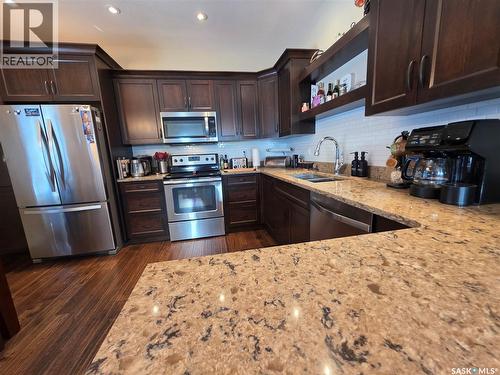 206 8Th Avenue Ne, Swift Current, SK - Indoor Photo Showing Kitchen With Stainless Steel Kitchen With Double Sink