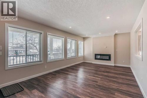 23 Cheltenham Road Nw, Calgary, AB - Indoor With Fireplace