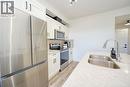 3409, 200 Seton Circle Se, Calgary, AB  - Indoor Photo Showing Kitchen With Stainless Steel Kitchen With Double Sink 