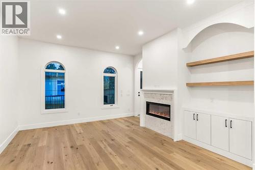 520 34A Street Nw, Calgary, AB - Indoor Photo Showing Other Room With Fireplace