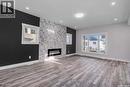 707 Nazarali Union, Saskatoon, SK  - Indoor Photo Showing Living Room With Fireplace 