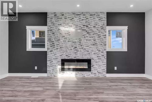 707 Nazarali Union, Saskatoon, SK - Indoor Photo Showing Living Room With Fireplace