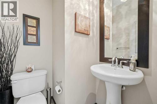 Main floor half bath - 65 Elgin Meadows Circle Se, Calgary, AB - Indoor Photo Showing Bathroom